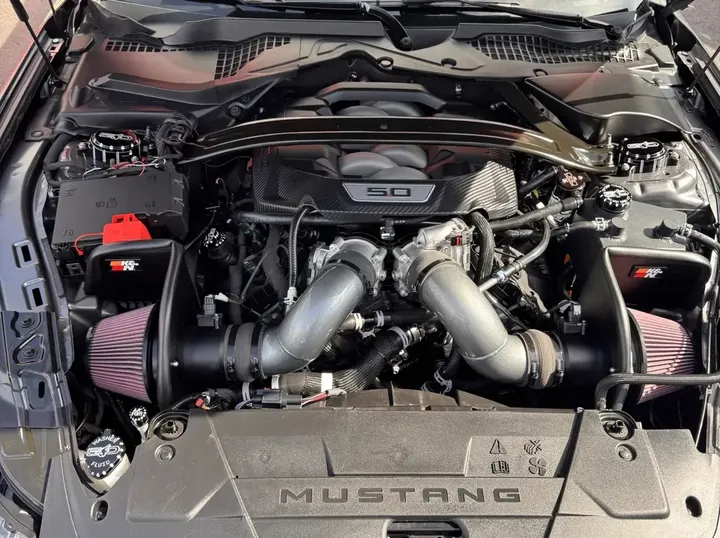 Engine bay of the Mustang with numbered markers on each custom part